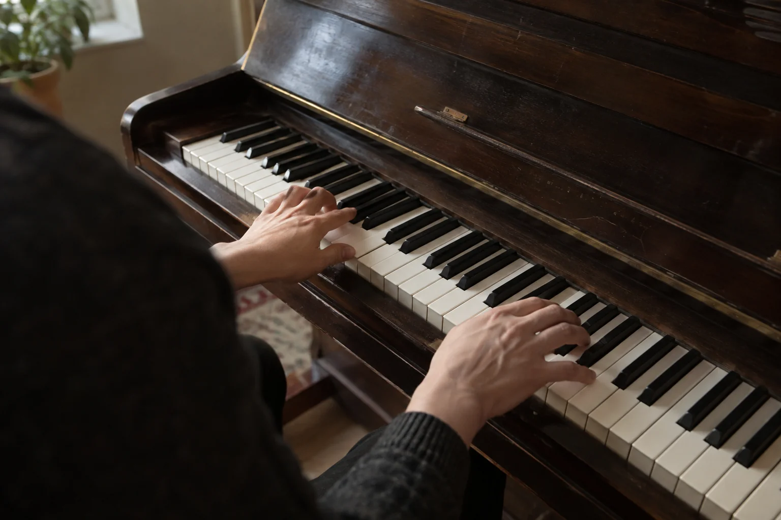 Hands at a grand piano