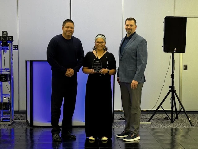 CEAT members presenting an award at an association event